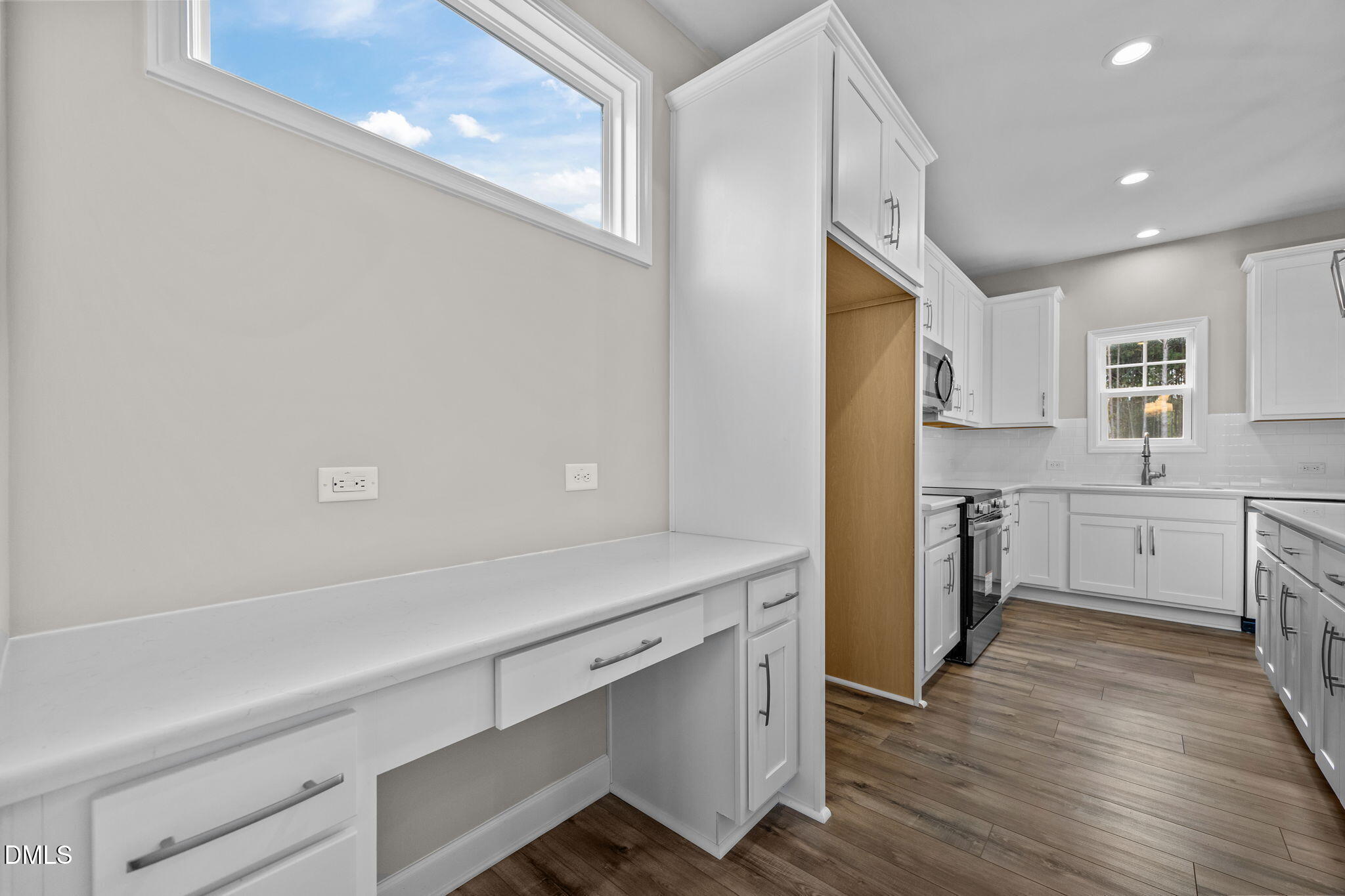 74 Cardovia Way Wendell, NC 27591 - Photo 6 of 34 a kitchen with a refrigerator and a sink