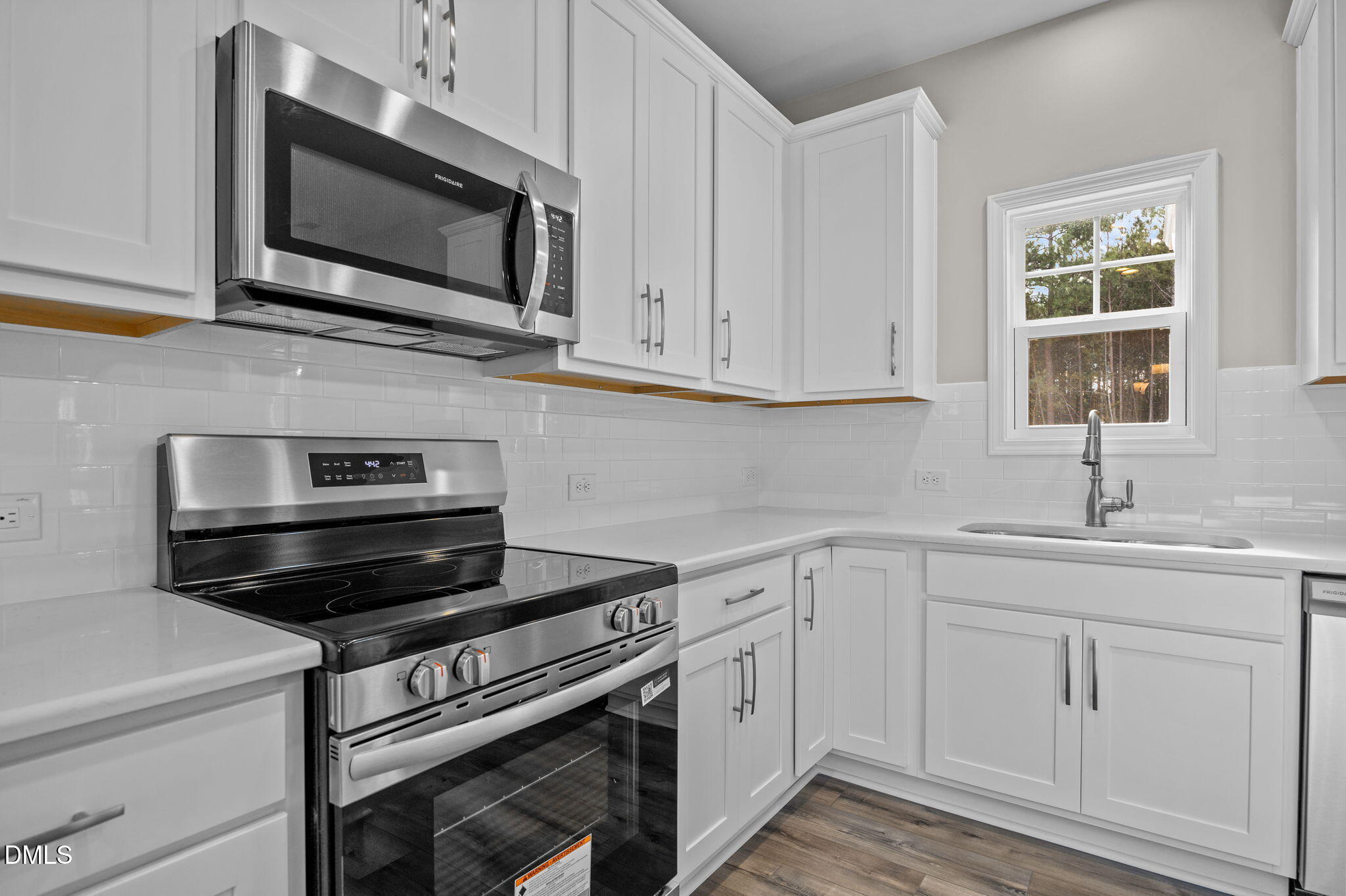 74 Cardovia Way Wendell, NC 27591 - Photo 8 of 34 a kitchen with cabinets stainless steel appliances and a sink