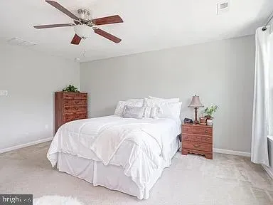 a bedroom with a bed and a cabinets