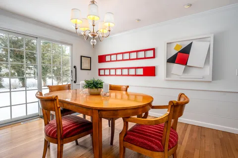 a kitchen with stainless steel appliances a sink cabinets and a window