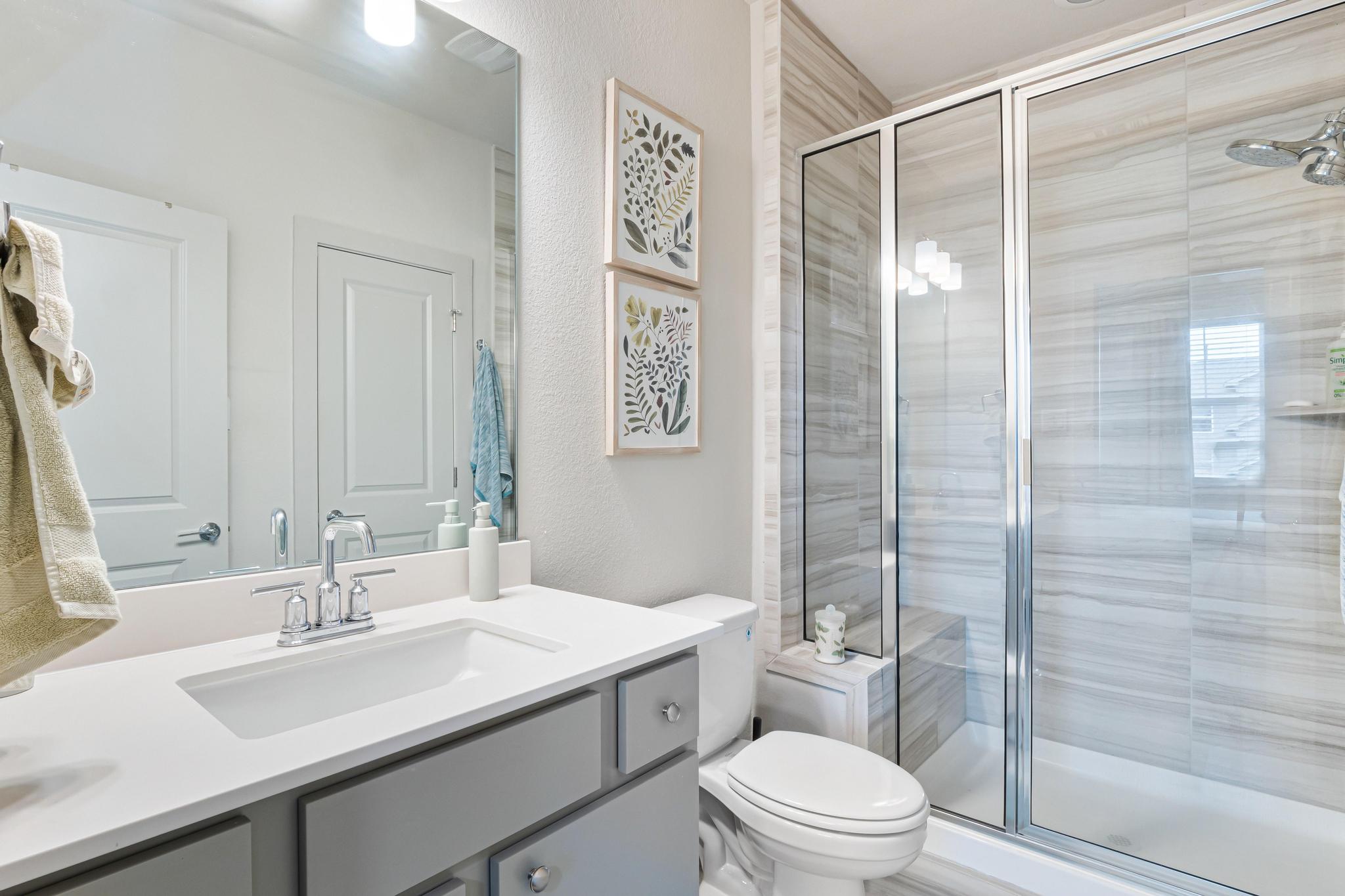 2301 Local Rebel Street Leander, TX 78641 - Photo 17 of 21 a bathroom with a sink a toilet and shower