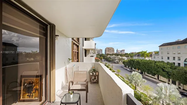 a view of balcony with furniture