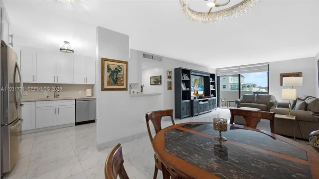a living room with granite countertop furniture a fireplace and a large window