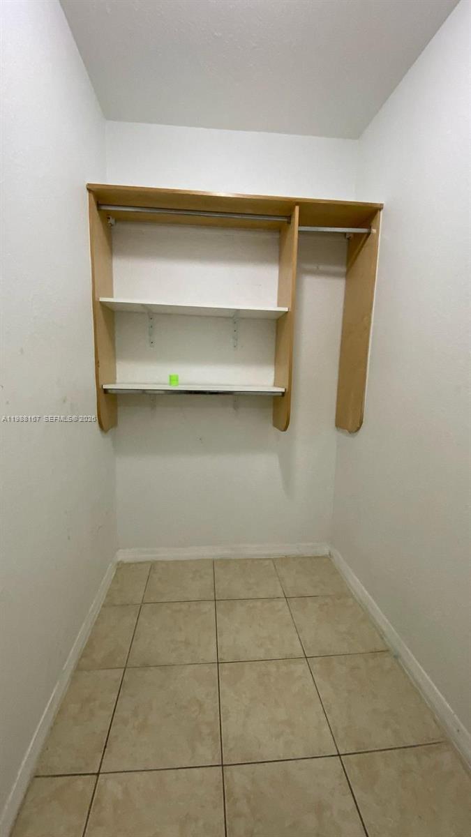 1021 Northwest 3rd Street, Unit 206 Miami, FL 33128 - Photo 11 of 13 a storage room with an empty racks