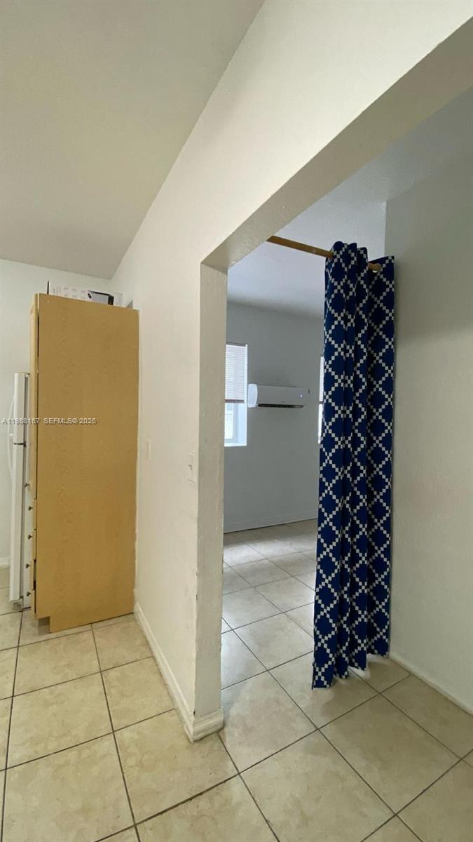 1021 Northwest 3rd Street, Unit 206 Miami, FL 33128 - Photo 12 of 13 a room with a black white checkered shelf