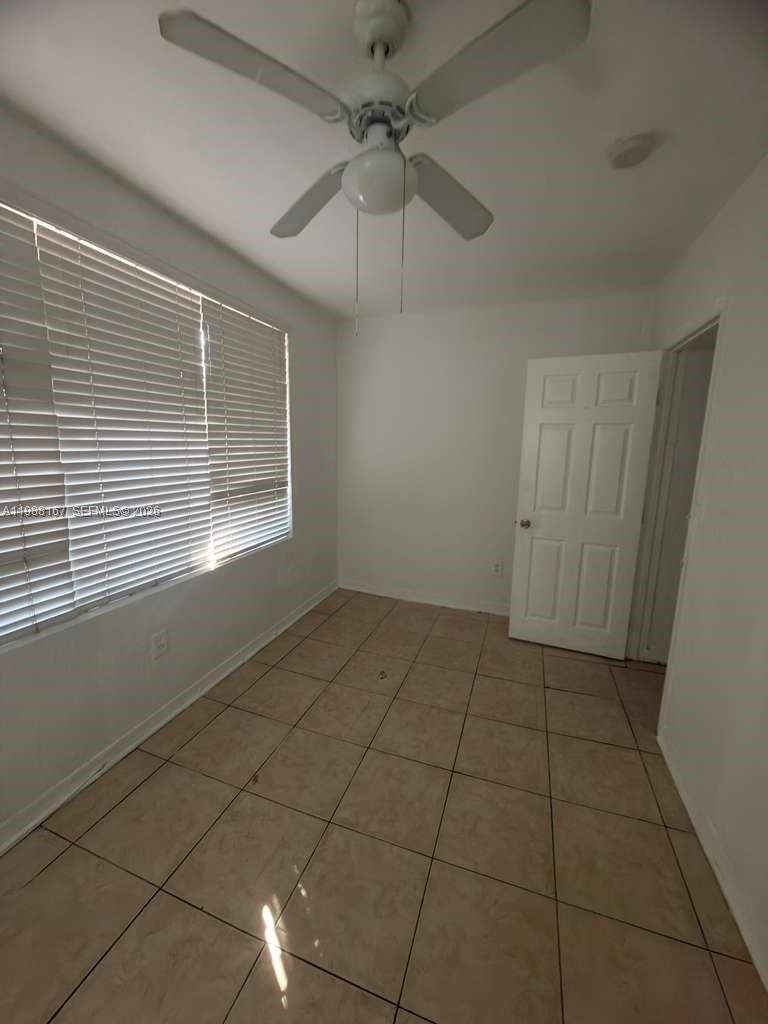 1021 Northwest 3rd Street, Unit 206 Miami, FL 33128 - Photo 5 of 13 a view of an empty room with a window
