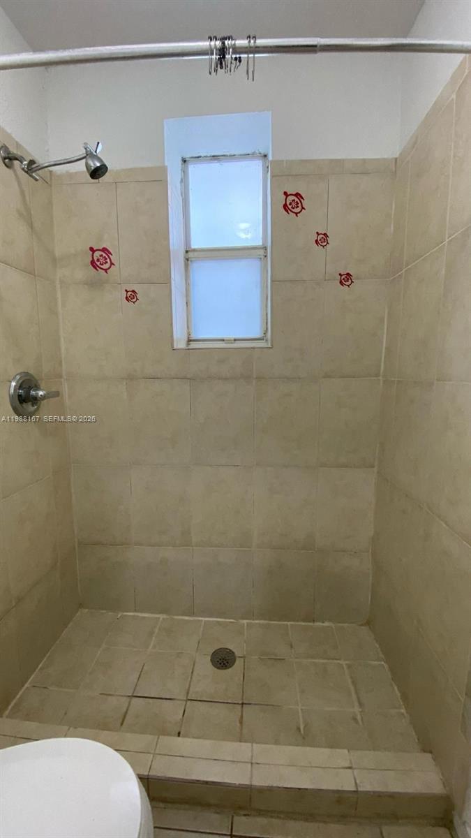 1021 Northwest 3rd Street, Unit 206 Miami, FL 33128 - Photo 7 of 13 a bathroom with a shower