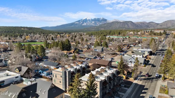 a view of a city with mountains in the background