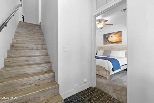 a view of bedroom and bedroom with wooden floor