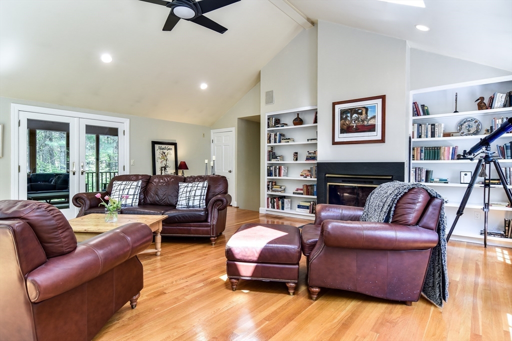 114 Hunters Ridge Road Concord, MA 01742 - Photo 19 of 38 a living room with furniture or couch and a bookshelf