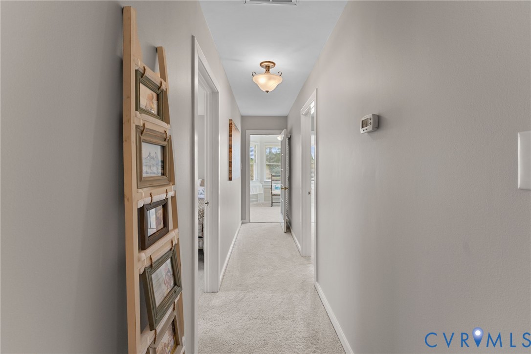 353 Jackson Creek Road Deltaville, VA 23043 - Photo 26 of 48 Hallway leading to primary suite & sun room/sittin