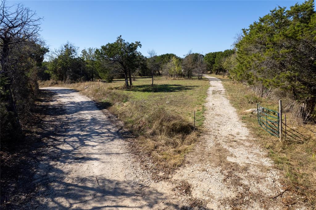 17574 Meador Grove Road Moody, TX 76557 - Photo 1 of 4 a view of a lake with trees in the background