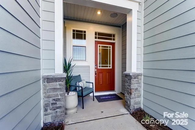 a potted plant sitting in front of a glass door
