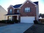 8296 Milam Loop Fairburn, GA 30213 - Photo 1 of 1 a front view of a house with a yard