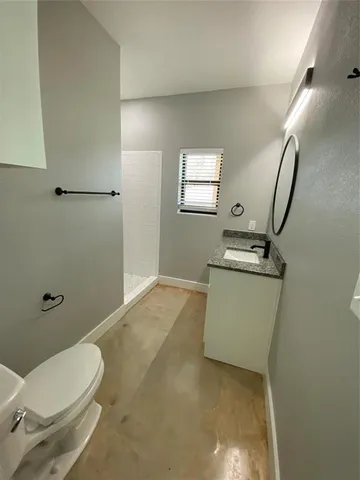 a bathroom with a shower and a sink