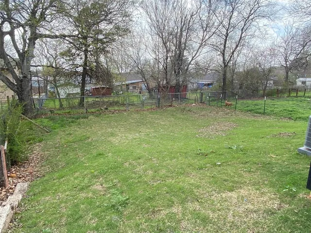 a view of front door and yard