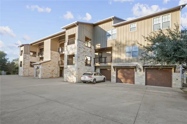 a living room with furniture and chandelier