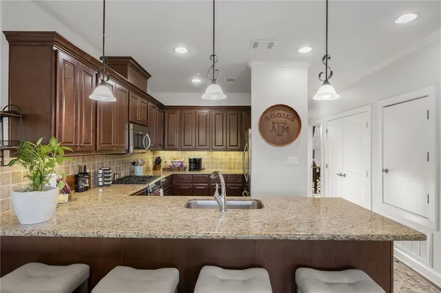 a bathroom with a granite countertop sink mirror and double