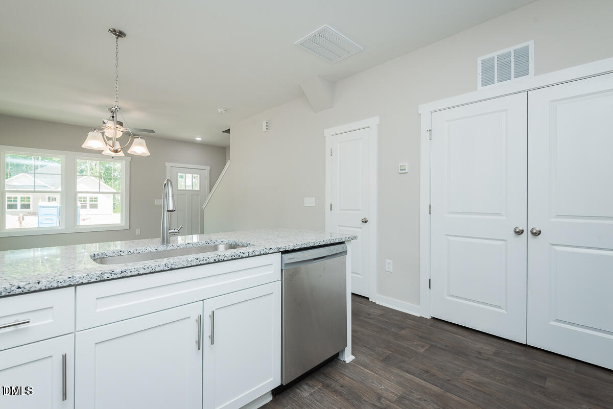 1016 Pinnix Loop Burlington, NC 27217 - Photo 6 of 22 a bathroom with a granite countertop sink and a mirror