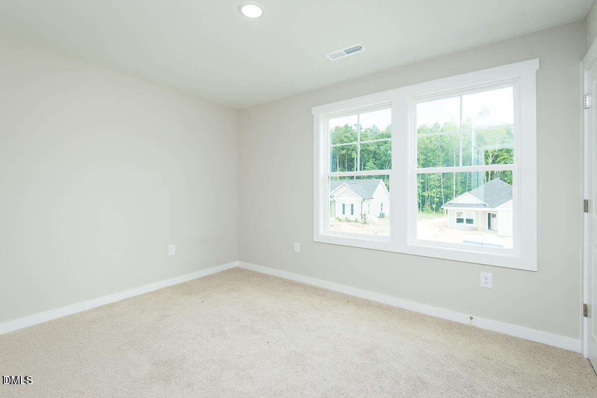 1016 Pinnix Loop Burlington, NC 27217 - Photo 10 of 22 an empty room with a window
