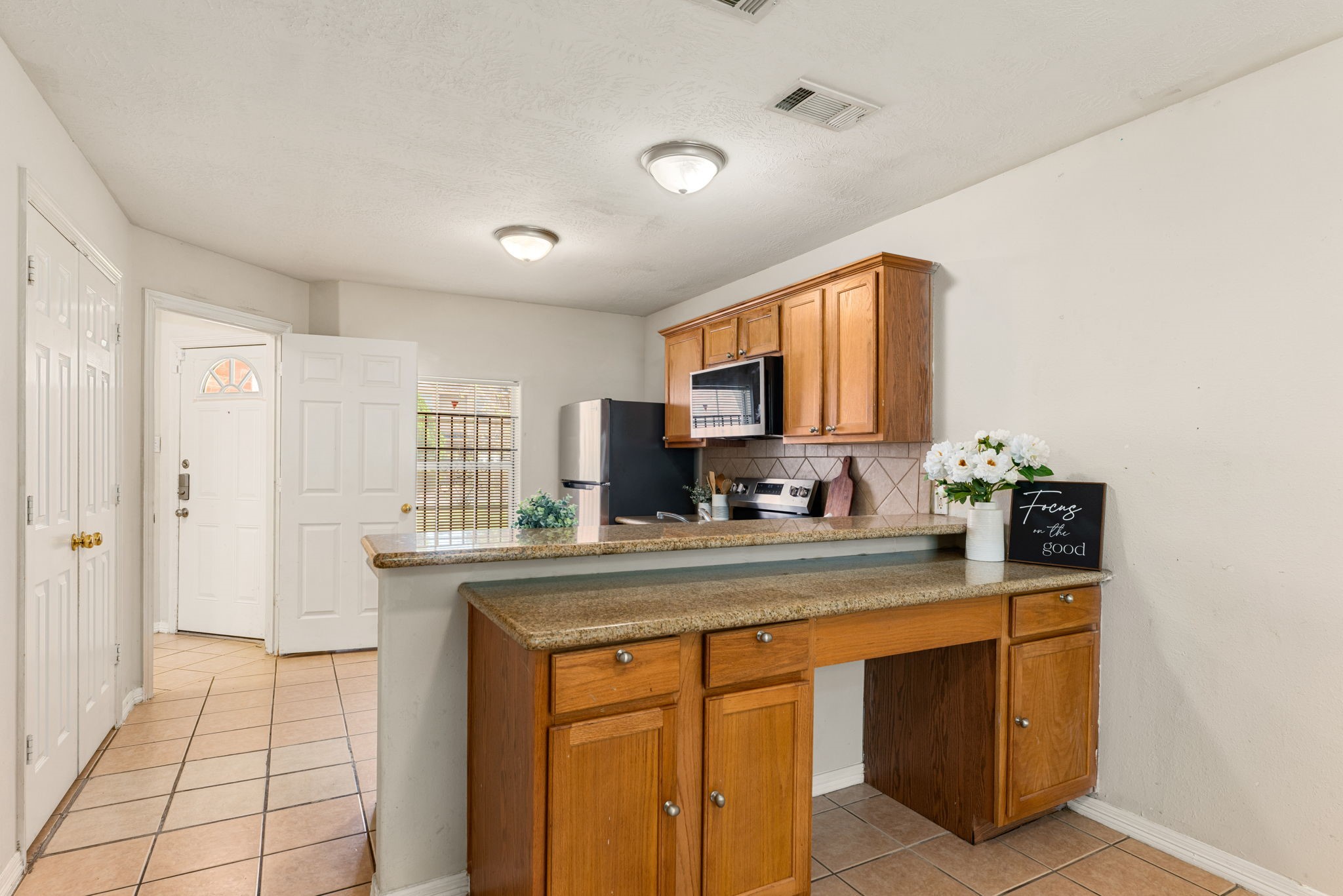 6418 England Street Houston, TX 77021 - Photo 8 of 29 a kitchen with stainless steel appliances granite countertop a sink and a stove