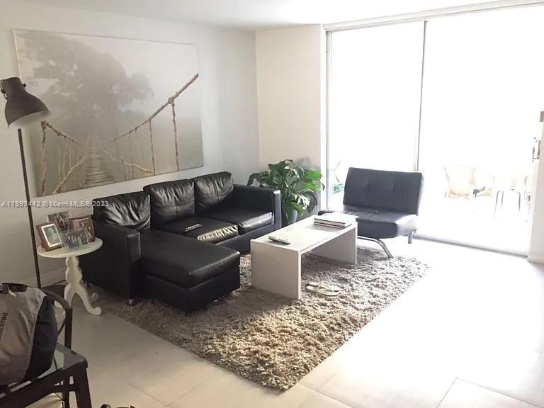 a living room with furniture and rug