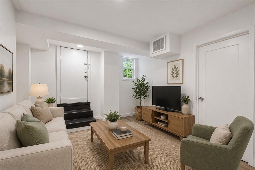 2526 Semmes Street Atlanta, GA 30344 - Photo 11 of 29 a living room with furniture and a flat screen tv