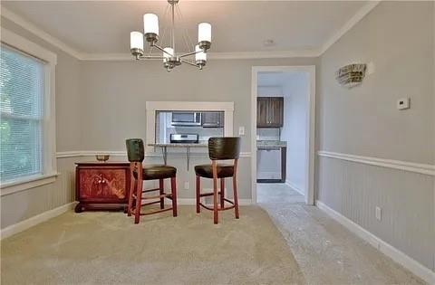 2526 Semmes Street Atlanta, GA 30344 - Photo 17 of 29 a living room with furniture and a chandelier