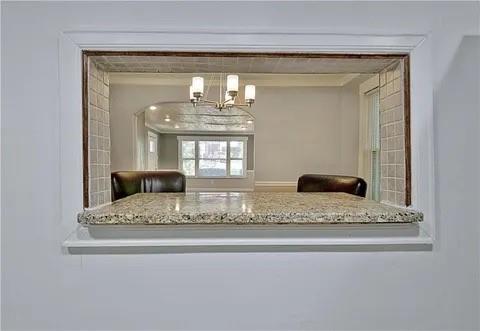 2526 Semmes Street Atlanta, GA 30344 - Photo 20 of 29 a view of living room with a chandelier and fireplace