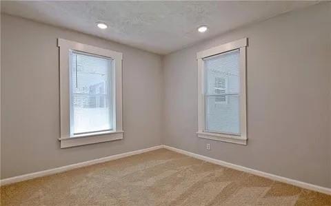 2526 Semmes Street Atlanta, GA 30344 - Photo 24 of 29 an empty room with windows and closet