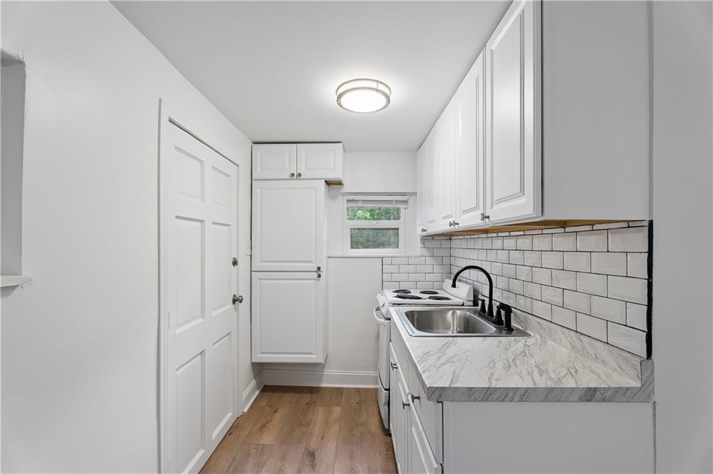 2526 Semmes Street Atlanta, GA 30344 - Photo 5 of 29 a kitchen with a sink and refrigerator