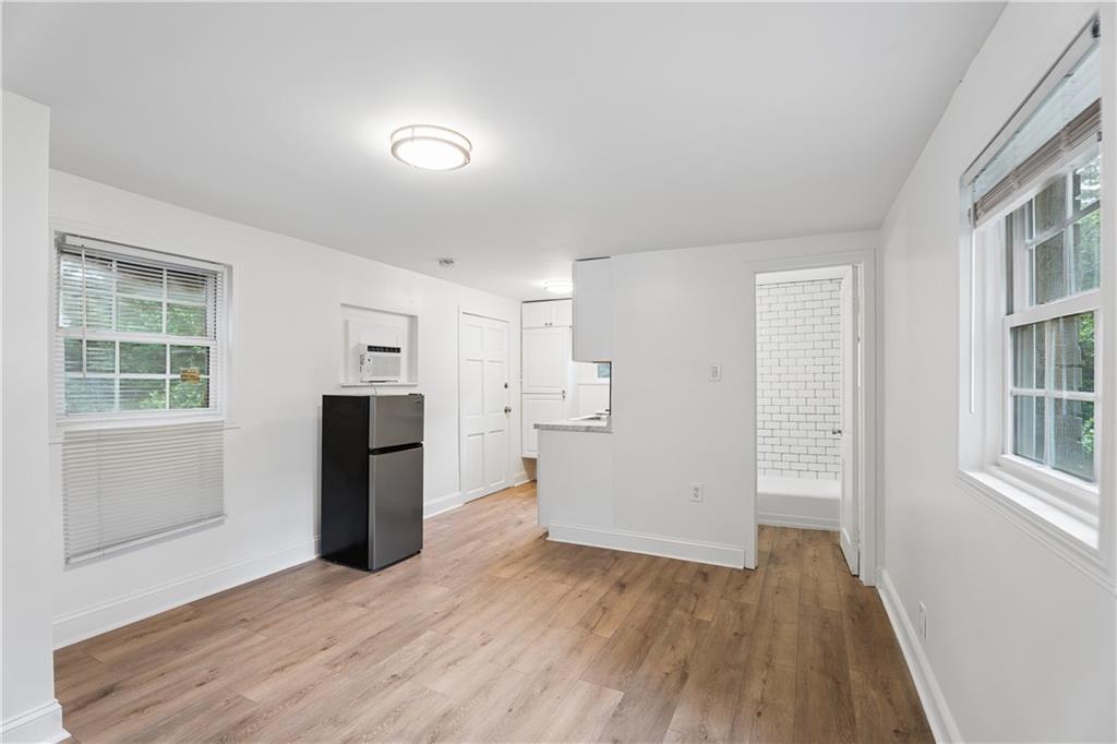 2526 Semmes Street Atlanta, GA 30344 - Photo 8 of 29 a view of empty room with wooden floor and fan