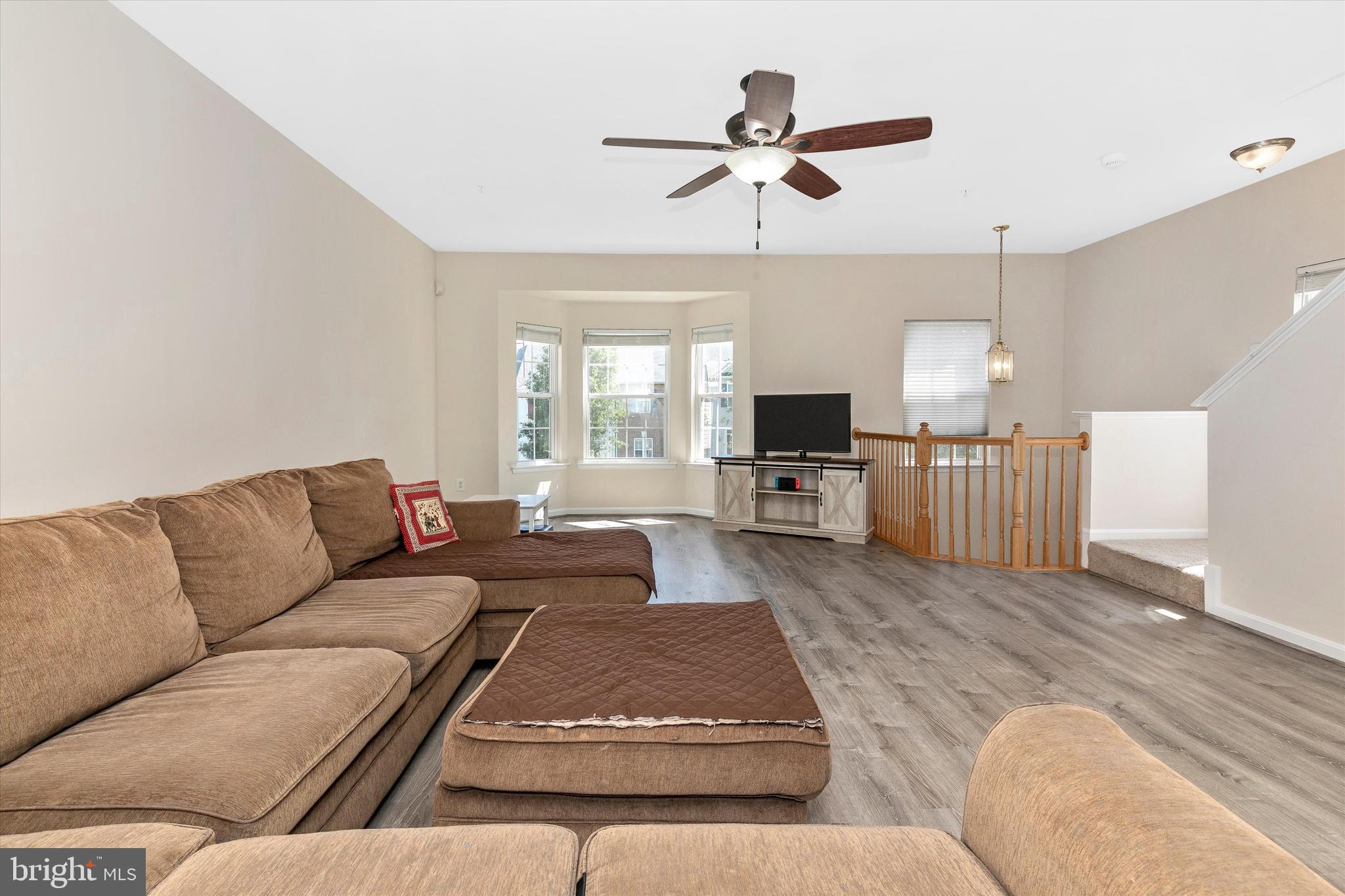 1742 Trestle Street Mount Airy, MD 21771 - Photo 12 of 58 a living room with furniture and a wooden floor