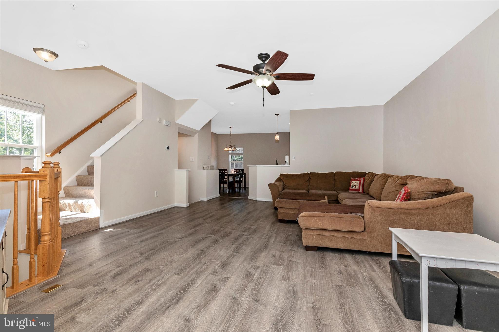 1742 Trestle Street Mount Airy, MD 21771 - Photo 15 of 58 a living room with furniture and a wooden floor