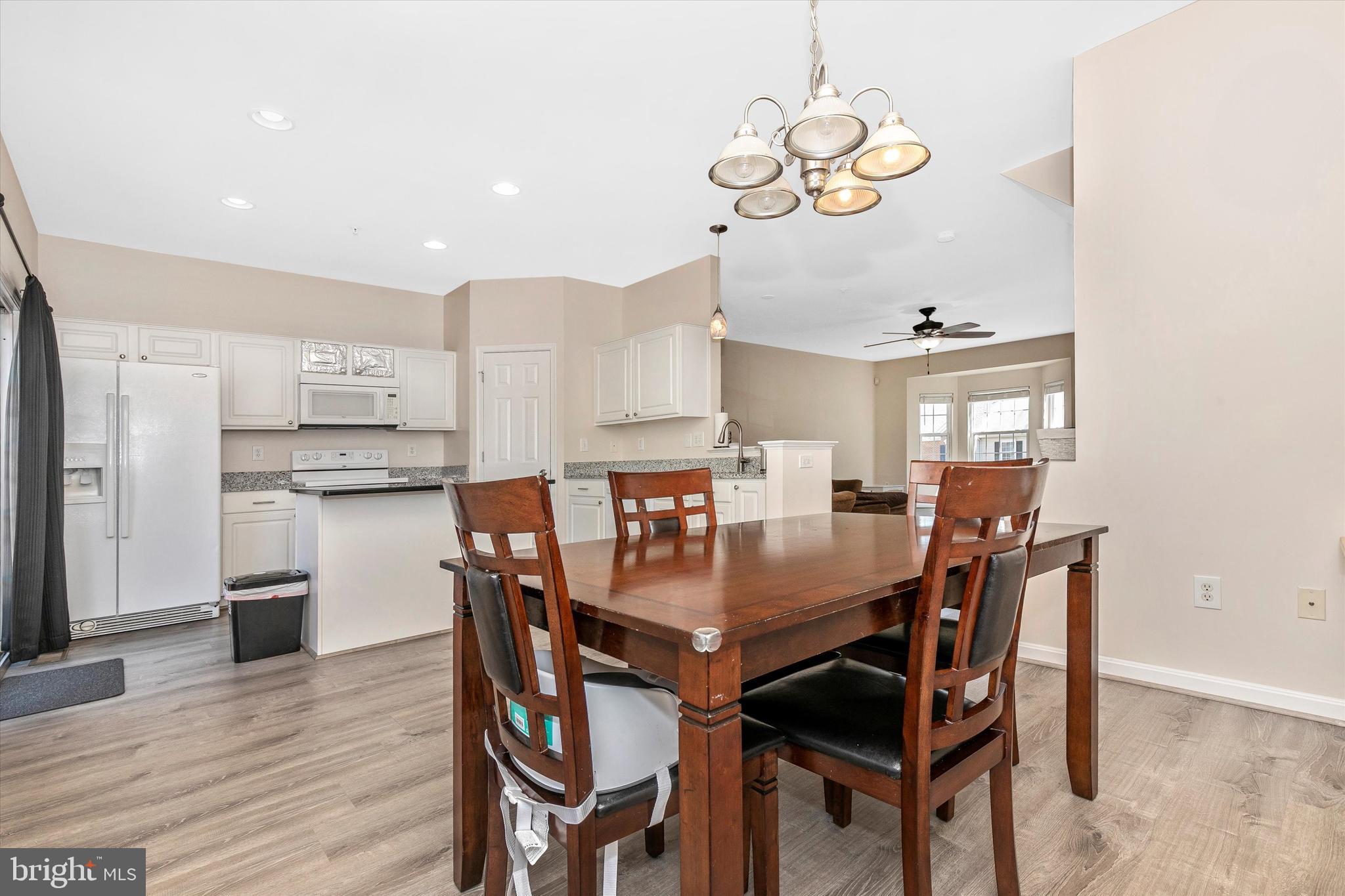 1742 Trestle Street Mount Airy, MD 21771 - Photo 21 of 58 a dining room with kitchen island a table and chairs