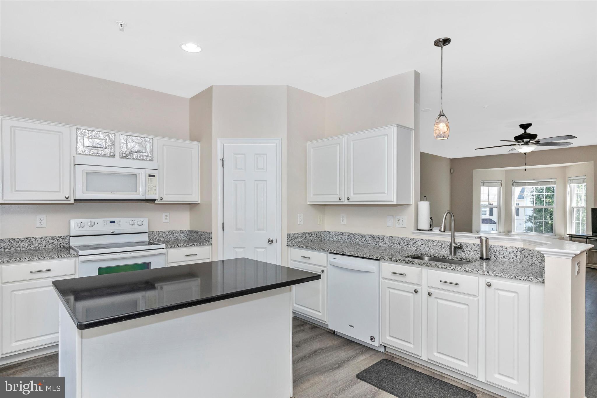 1742 Trestle Street Mount Airy, MD 21771 - Photo 25 of 58 a kitchen with stainless steel appliances granite countertop a sink stove and cabinets