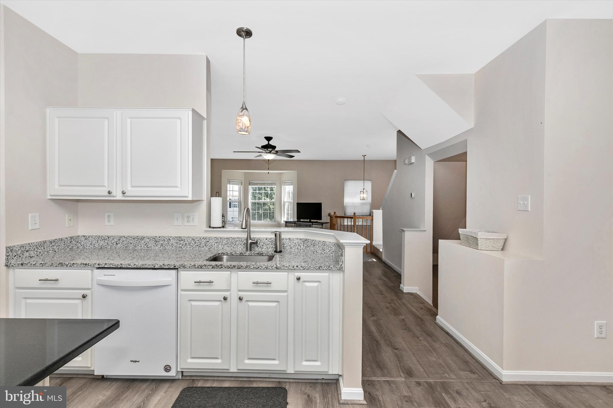 1742 Trestle Street Mount Airy, MD 21771 - Photo 27 of 58 a kitchen with kitchen island granite countertop a sink cabinets and stainless steel appliances
