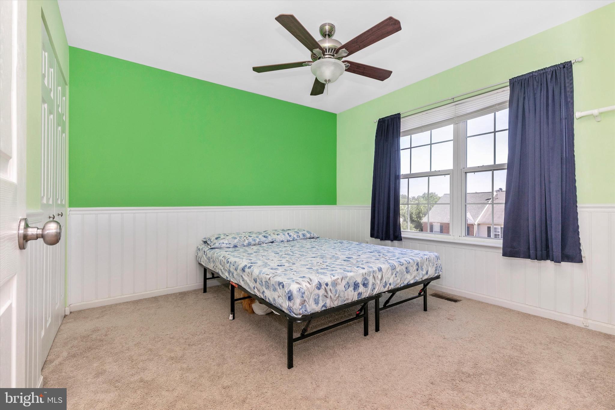 1742 Trestle Street Mount Airy, MD 21771 - Photo 35 of 58 a living room with a bed furniture and a large window