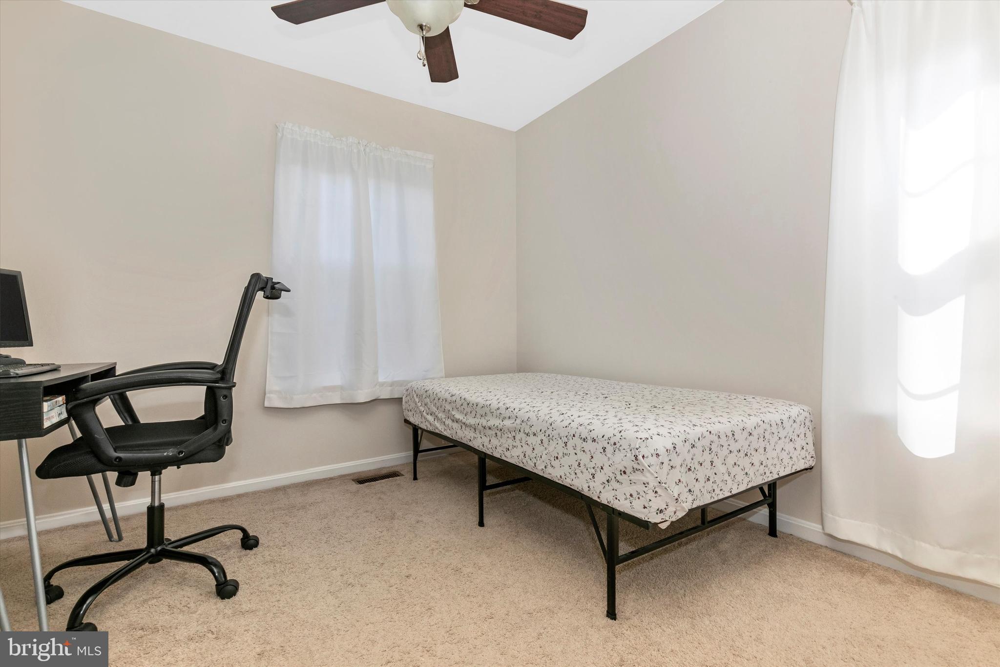 1742 Trestle Street Mount Airy, MD 21771 - Photo 36 of 58 a bedroom with a bed window and chair