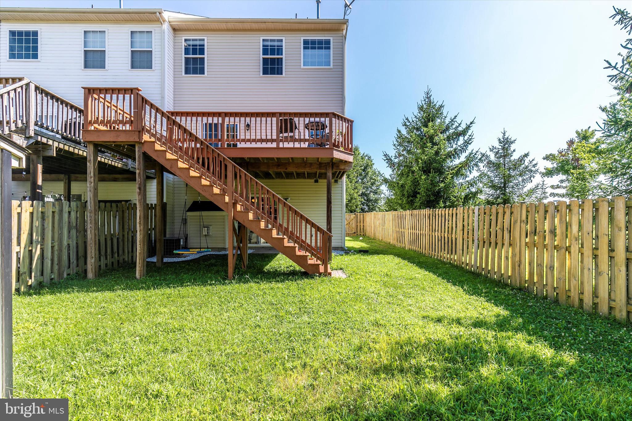 1742 Trestle Street Mount Airy, MD 21771 - Photo 44 of 58 a backyard of a house with table and chairs