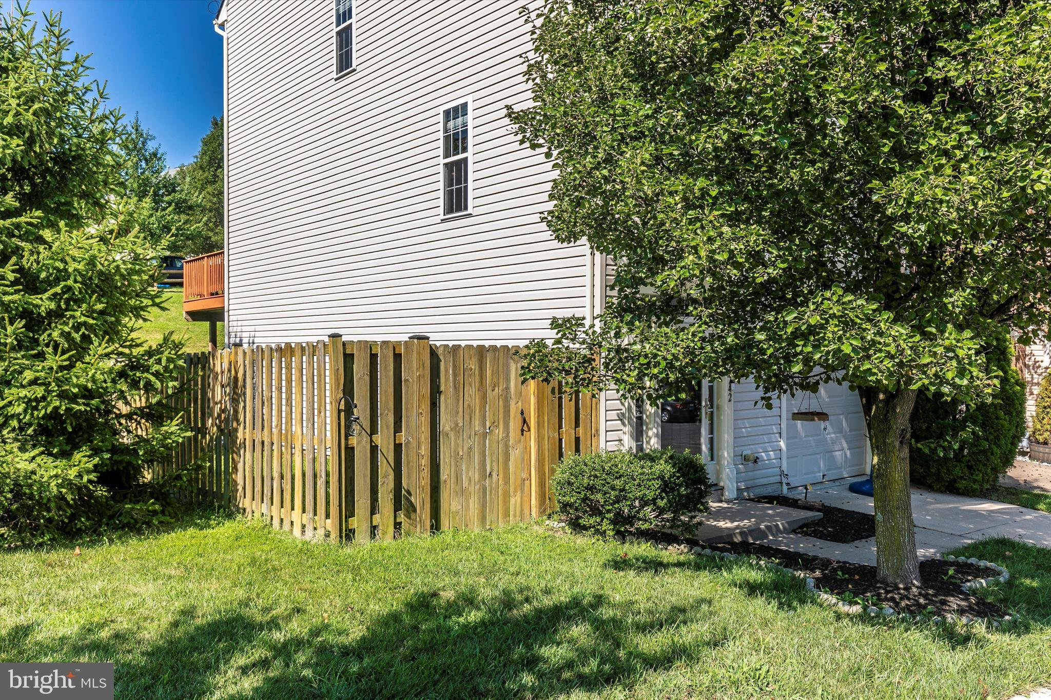 1742 Trestle Street Mount Airy, MD 21771 - Photo 48 of 58 a front view of a house with a garden