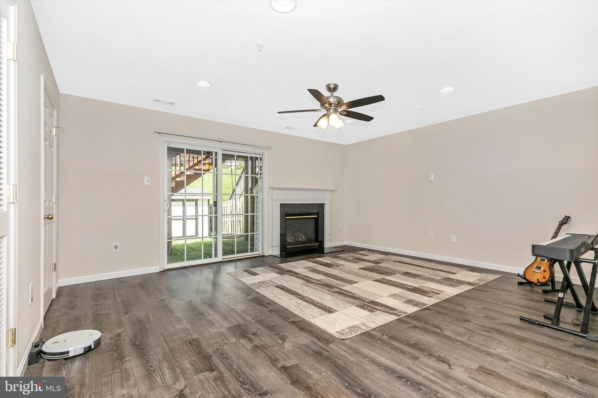1742 Trestle Street Mount Airy, MD 21771 - Photo 5 of 58 a view of an empty room with glass door and wooden floor