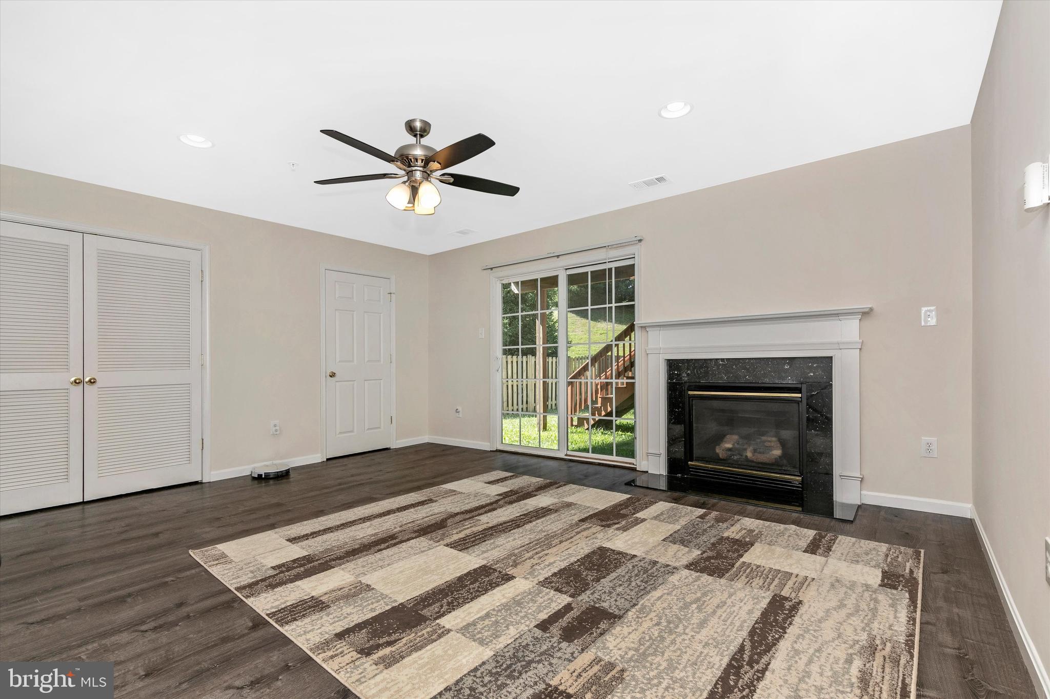 1742 Trestle Street Mount Airy, MD 21771 - Photo 6 of 58 a bedroom with a bed and a fireplace