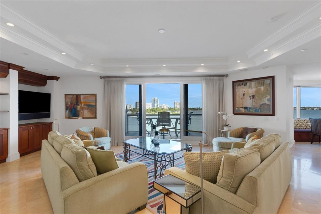 464 Golden Gate Point, Unit 403 Sarasota, FL 34236 - Photo 12 of 95 a living room with furniture and a large window
