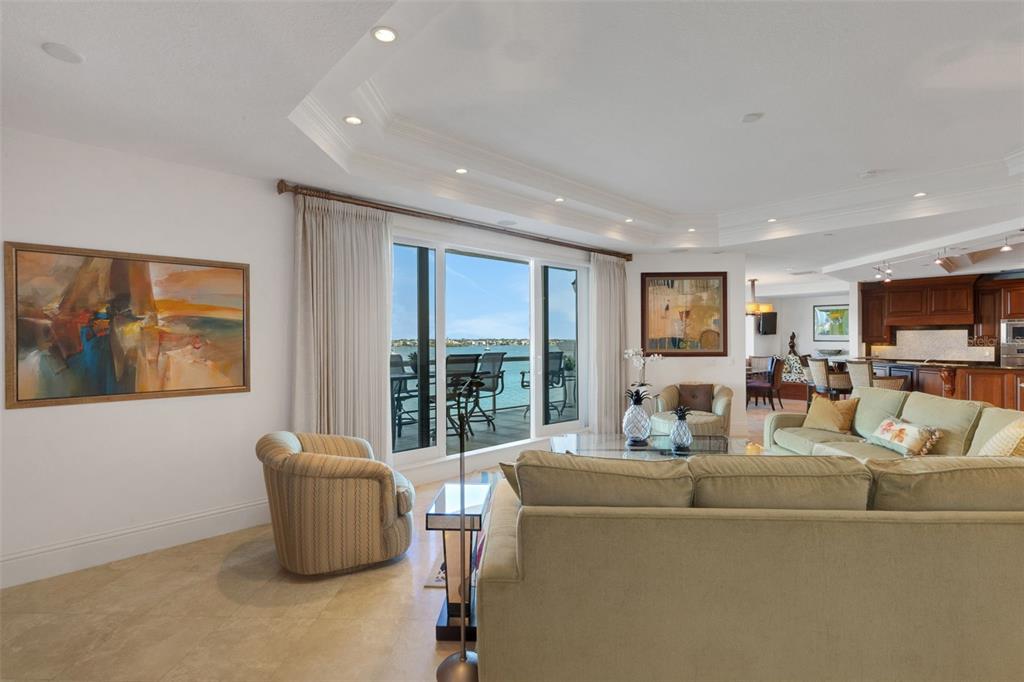 464 Golden Gate Point, Unit 403 Sarasota, FL 34236 - Photo 14 of 95 a living room with furniture and a floor to ceiling window