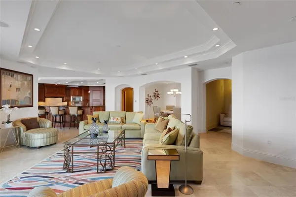 a view of a balcony with chairs and potted plants