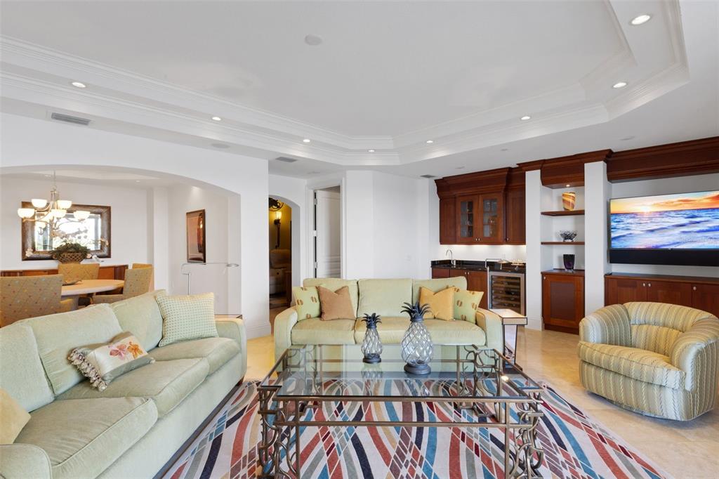 464 Golden Gate Point, Unit 403 Sarasota, FL 34236 - Photo 16 of 95 a living room with furniture and a flat screen tv