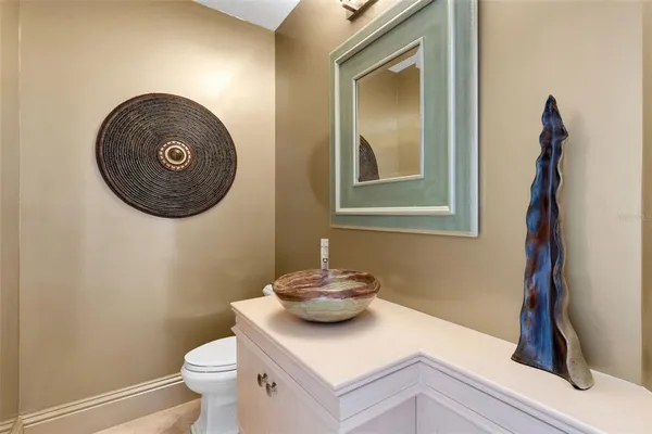 a kitchen with granite countertop a refrigerator and a stove