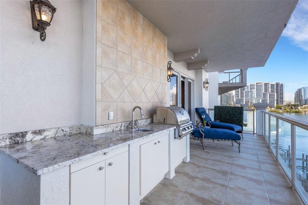 464 Golden Gate Point, Unit 403 Sarasota, FL 34236 - Photo 29 of 95 a spacious bathroom with double vanity and a granite counter tops