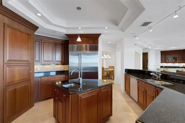 a bathroom with a sink a toilet a mirror and shower